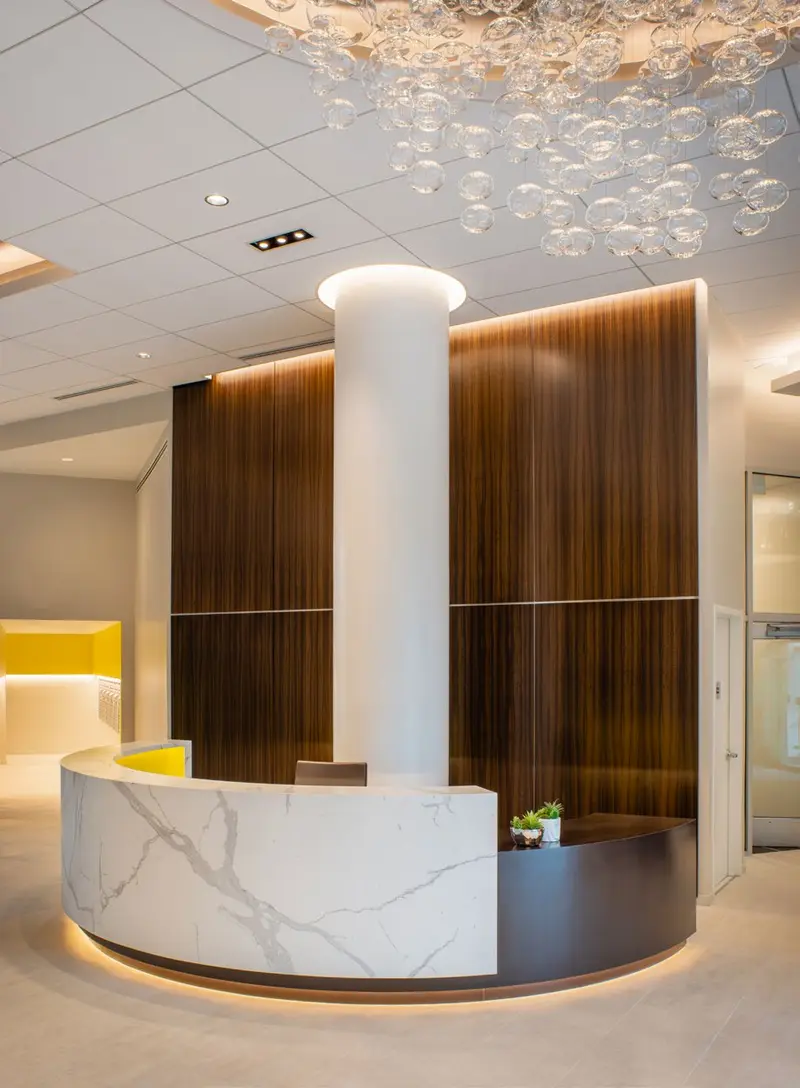Curved reception counter faced in Calacatta Trascenda slab