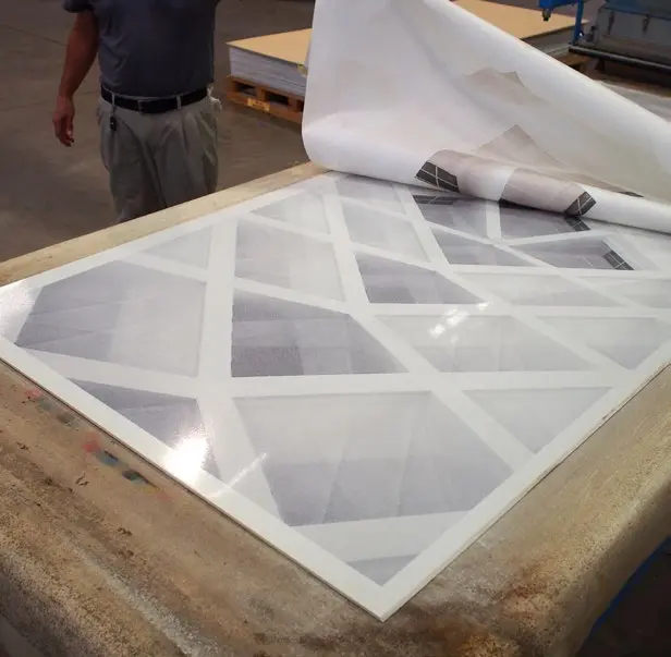 Production — the printed design being infused into the etherium slab surface at the factory