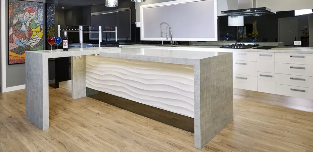 Kitchen island with Portland White Trascenda benchtop and waterfall ends