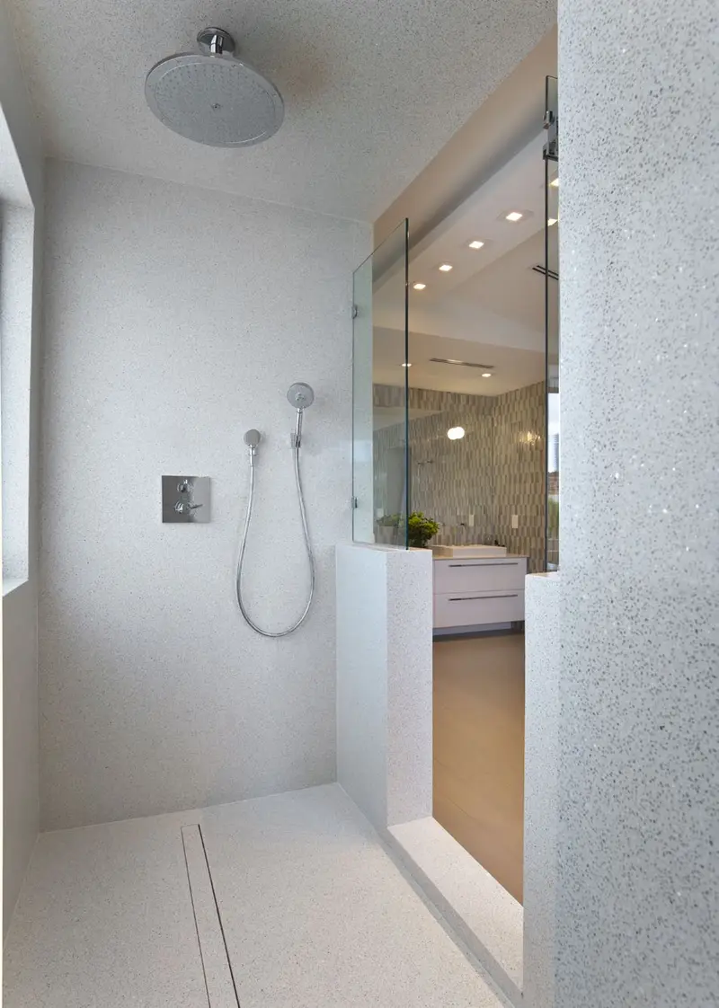 Walk-in shower in 1610 Royal Ivory etherium slab, walls and floor