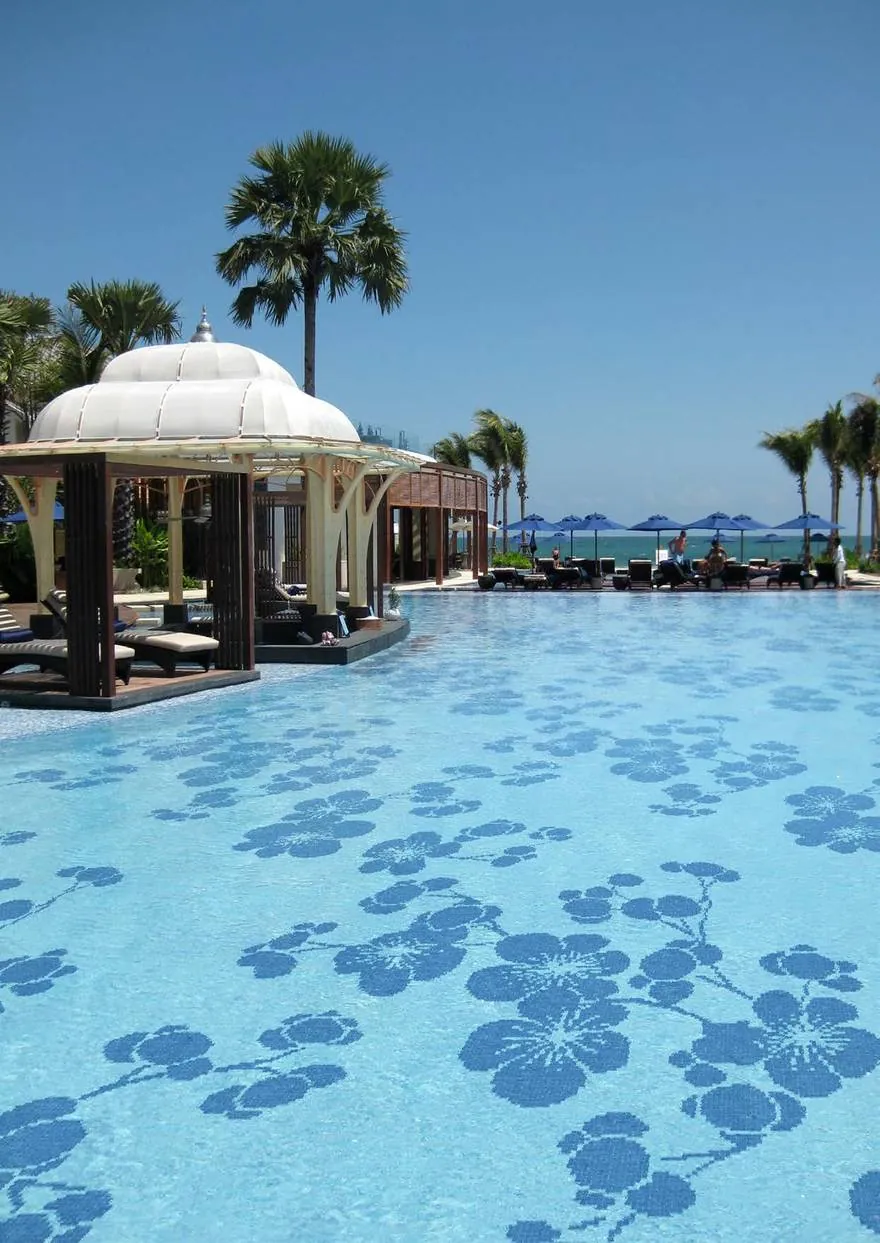 Resort pool in Bali with floral glass mosaic decors across the pool floor