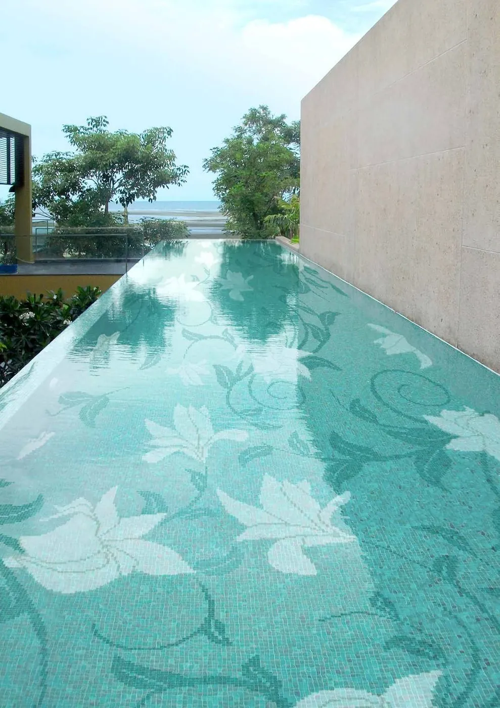 Water Garden infinity pool with custom botanical glass mosaic pattern